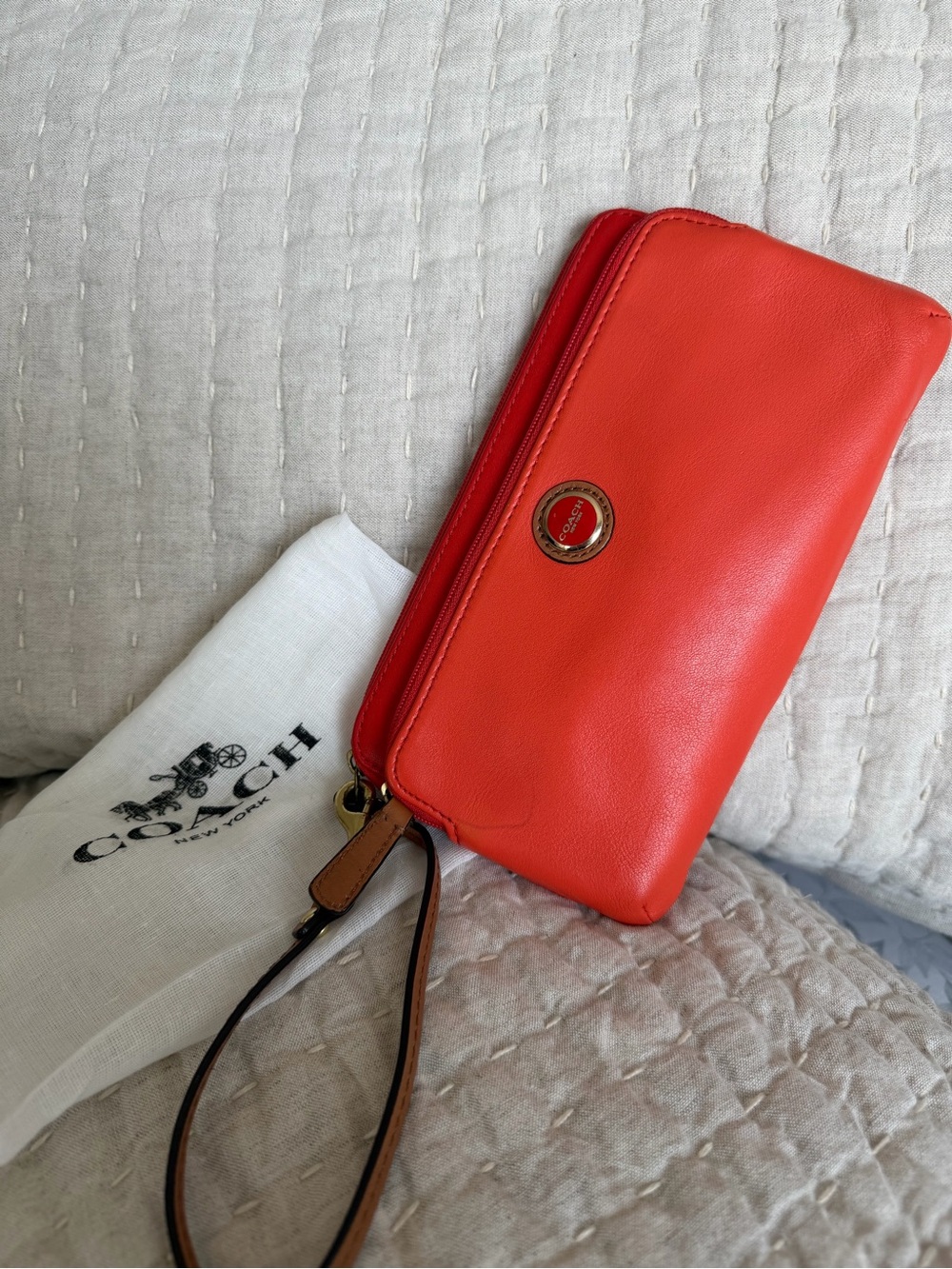 COACH Orange/red smooth leather double zipper wristlet/clutch